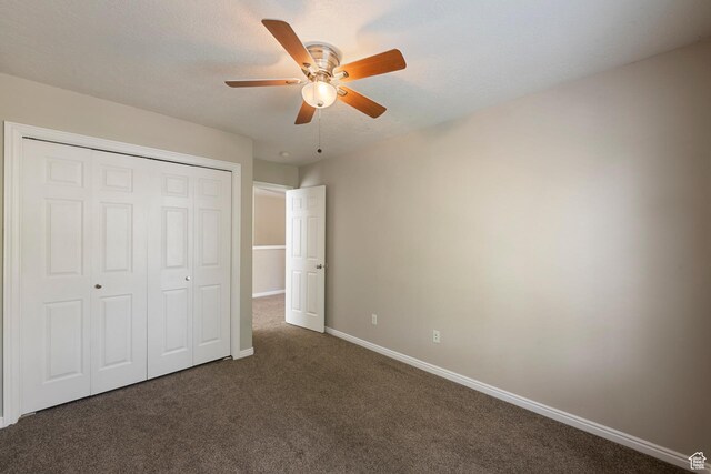 7883 N Geronimo Dr E, Eagle Mountain, UT 84005 - unfurnished bedroom with carpet floors, a ceiling fan, baseboards, and a closet