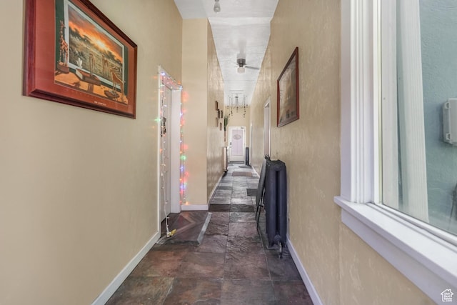 827 E 100 S, Salt Lake City, UT 84102 - hall featuring baseboards and stone finish flooring