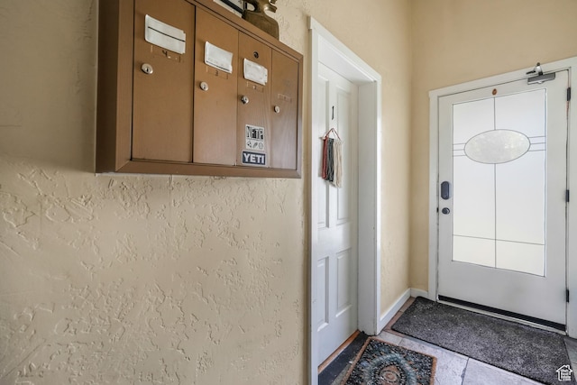 827 E 100 S, Salt Lake City, UT 84102 - doorway to outside featuring baseboards and tile patterned flooring