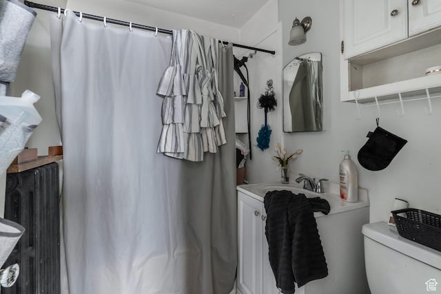 827 E 100 S, Salt Lake City, UT 84102 - full bathroom featuring toilet, a shower with curtain, radiator heating unit, and vanity