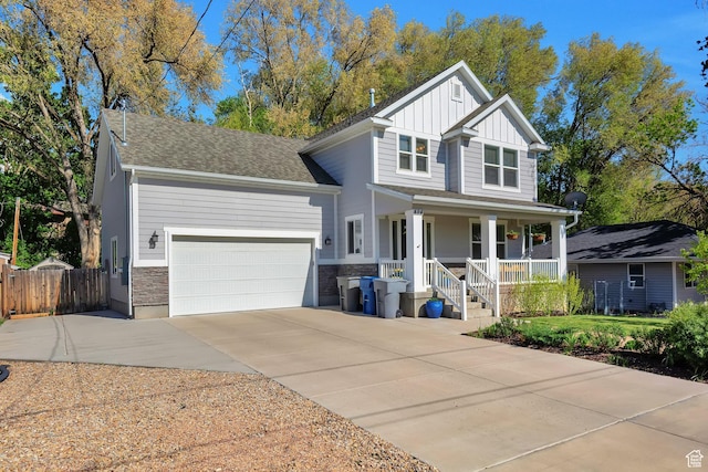 494 N 300 E, American Fork, UT 84003 - traditional home with covered porch, board and batten siding, a garage, fence, and concrete driveway