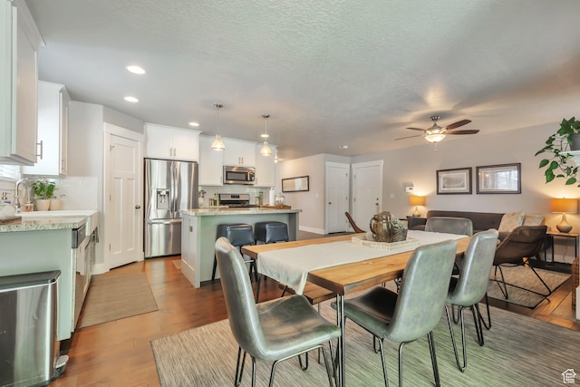494 N 300 E, American Fork, UT 84003 - dining area with recessed lighting, a ceiling fan, a textured ceiling, and light wood-type flooring