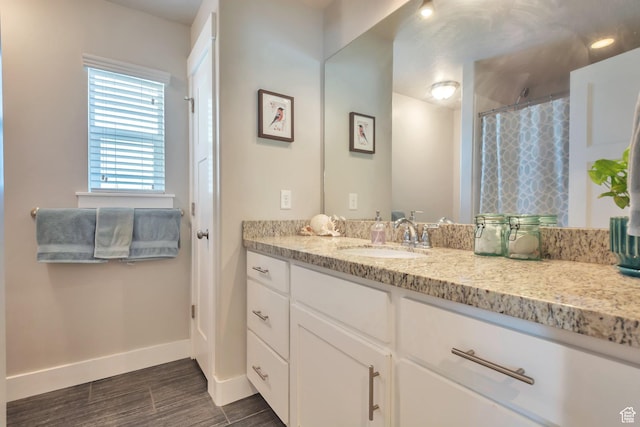 494 N 300 E, American Fork, UT 84003 - full bathroom featuring baseboards, vanity, curtained shower, and wood finished floors