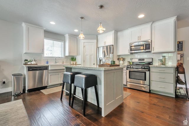 494 N 300 E, American Fork, UT 84003 - kitchen with a center island, backsplash, stainless steel appliances, and recessed lighting