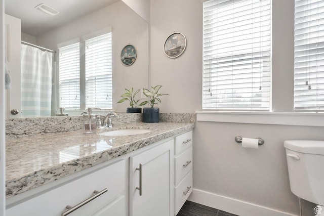 494 N 300 E, American Fork, UT 84003 - full bath with vanity, baseboards, visible vents, and toilet