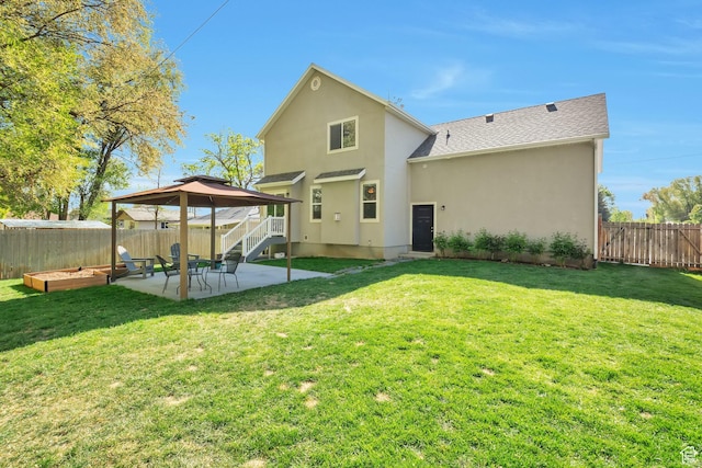 494 N 300 E, American Fork, UT 84003 - back of property featuring a lawn, a patio, a fenced backyard, stucco siding, and a gazebo