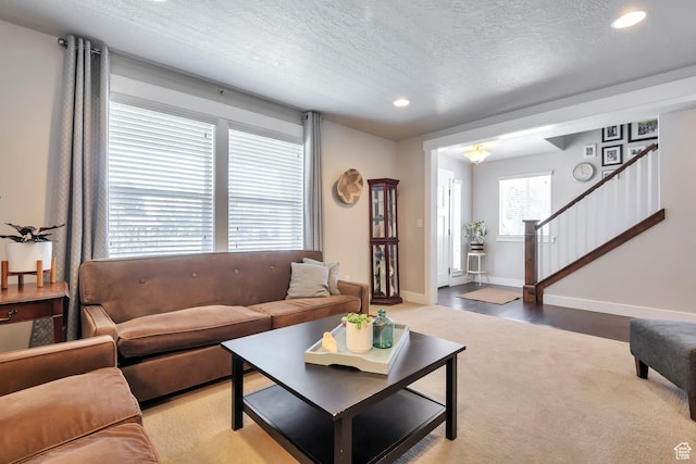 494 N 300 E, American Fork, UT 84003 - living area with light colored carpet, a textured ceiling, recessed lighting, baseboards, and stairway