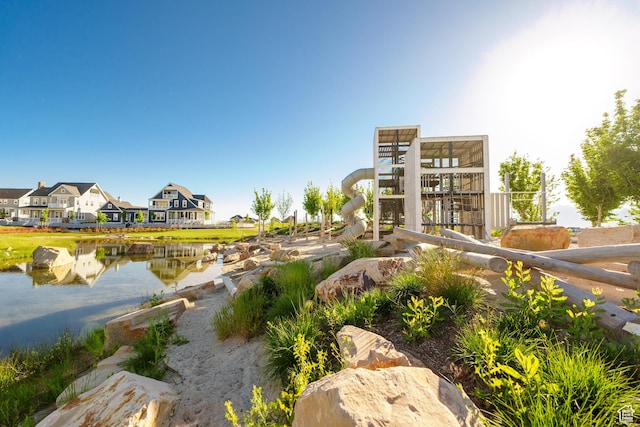 view of community with a water view