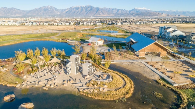aerial view featuring a water and mountain view