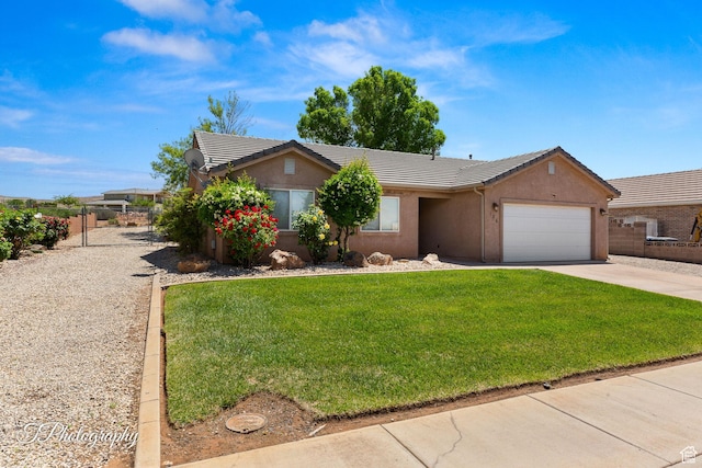 186 N 870 W, Hurricane, UT 84737 - ranch-style house with a tiled roof, a front yard, concrete driveway, an attached garage, and stucco siding