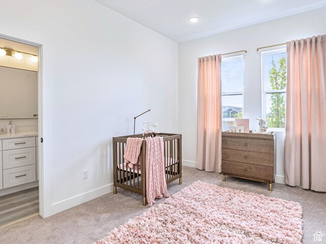 365 W 800 N Unit 3, Salt Lake City, UT 84103 - bedroom with baseboards, recessed lighting, a nursery area, and light carpet