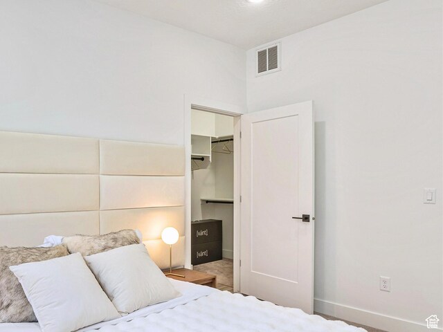 365 W 800 N Unit 3, Salt Lake City, UT 84103 - bedroom with visible vents, baseboards, a spacious closet, and a closet