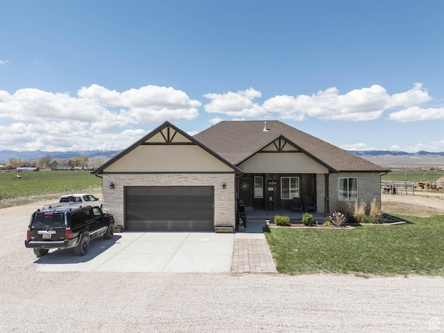 10360 S 10750 W, Axtell, UT 84621 - craftsman-style house with covered porch, a front yard, an attached garage, a mountain view, and driveway