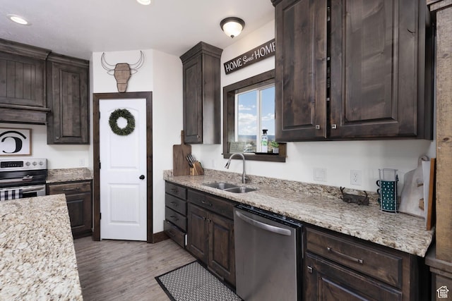10360 S 10750 W, Axtell, UT 84621 - kitchen with dark brown cabinets, appliances with stainless steel finishes, a sink, recessed lighting, and wood finished floors