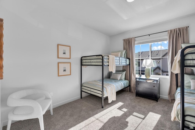 carpeted bedroom with baseboards