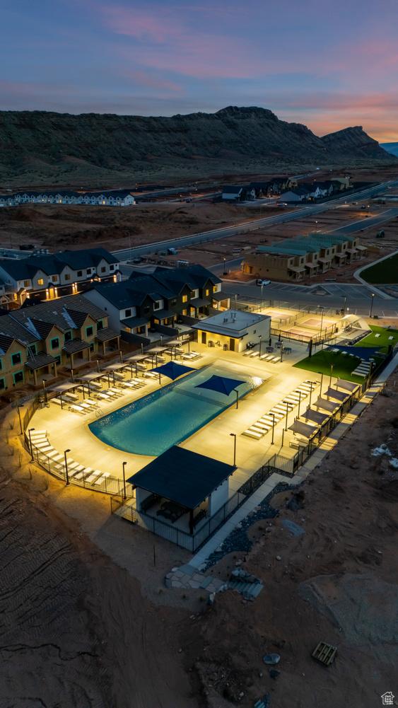 pool at dusk with a mountain view