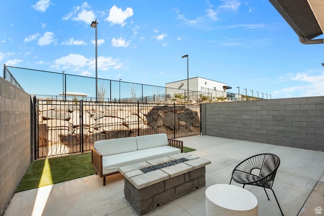 view of patio / terrace with a fenced backyard and an outdoor fire pit