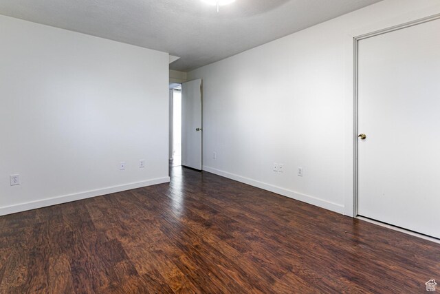 5952 S 2550 W, Roy, UT 84067 - unfurnished room featuring baseboards and dark wood-style floors