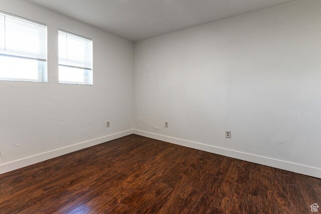 5952 S 2550 W, Roy, UT 84067 - spare room featuring baseboards and dark wood-style flooring