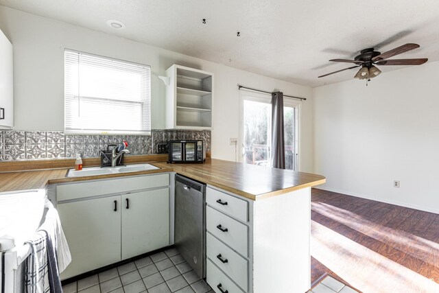 5952 S 2550 W, Roy, UT 84067 - kitchen with ceiling fan, a sink, dishwasher, a peninsula, and backsplash