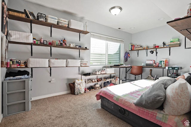 bedroom featuring baseboards and carpet