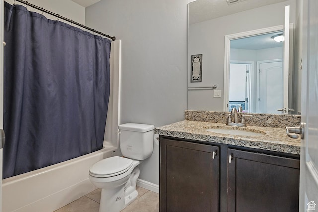 bathroom featuring tile patterned flooring, shower / tub combo with curtain, vanity, toilet, and baseboards