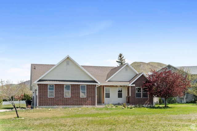 220 N 810 E, Smithfield, UT 84335 - view of front of home with a mountain view, a shingled roof, and brick siding