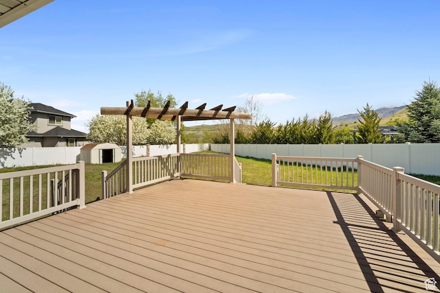 220 N 810 E, Smithfield, UT 84335 - deck featuring a lawn, a fenced backyard, a storage shed, and an outdoor structure