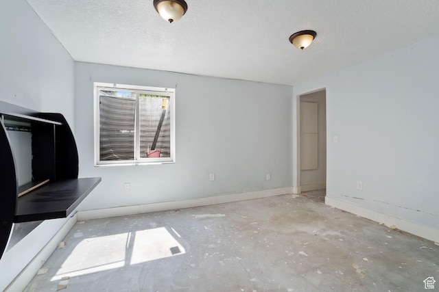 220 N 810 E, Smithfield, UT 84335 - unfurnished living room featuring baseboards and a textured ceiling