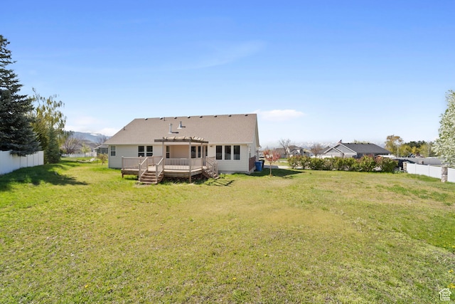 220 N 810 E, Smithfield, UT 84335 - back of property with a lawn, fence, a wooden deck, and a shingled roof