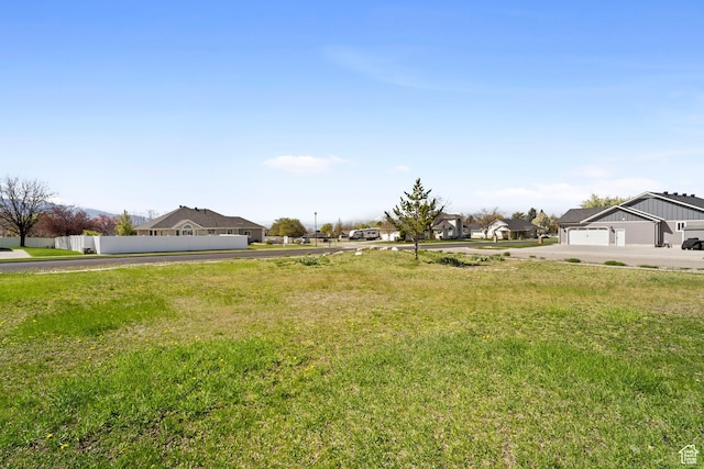 220 N 810 E, Smithfield, UT 84335 - view of yard with concrete driveway, fence, and a residential view
