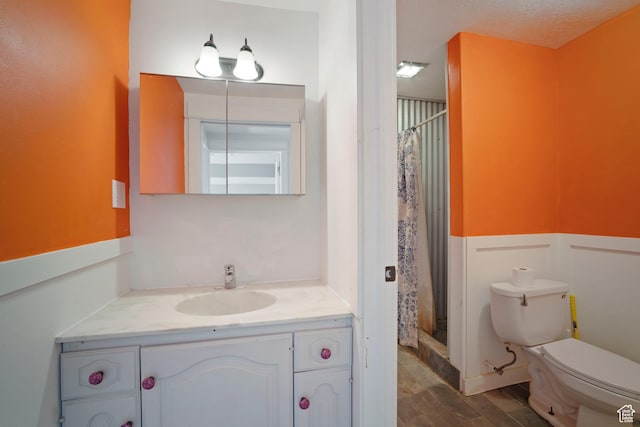 220 N 810 E, Smithfield, UT 84335 - full bathroom with a shower with shower curtain, toilet, wood finished floors, and vanity
