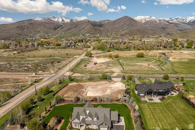 birds eye view of property with a mountain view