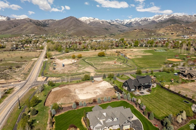 birds eye view of property with a mountain view