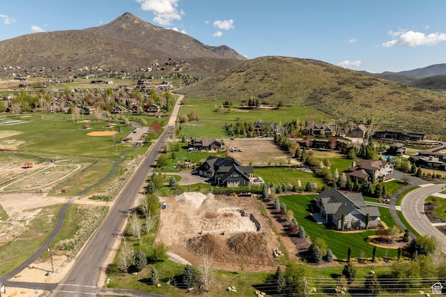 birds eye view of property with a residential view and a mountain view