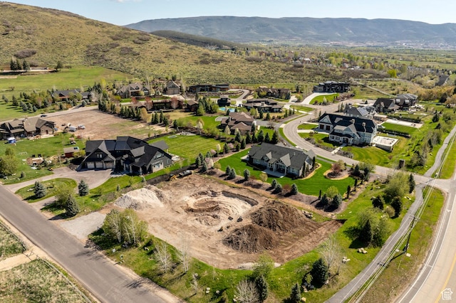 drone / aerial view with a residential view and a mountain view