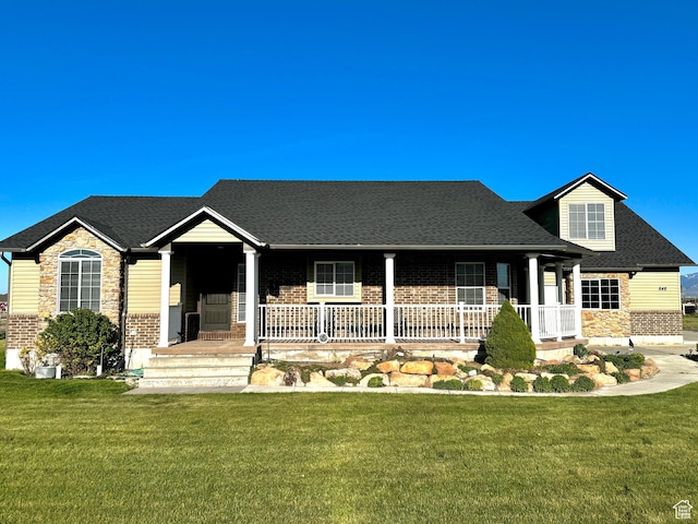 848 N Cooley St W, Grantsville, UT 84029 - ranch-style house with a porch, brick siding, stone siding, and a front lawn