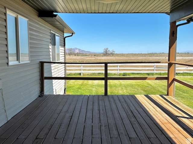 848 N Cooley St W, Grantsville, UT 84029 - wooden terrace featuring a lawn, fence, a mountain view, and a rural view