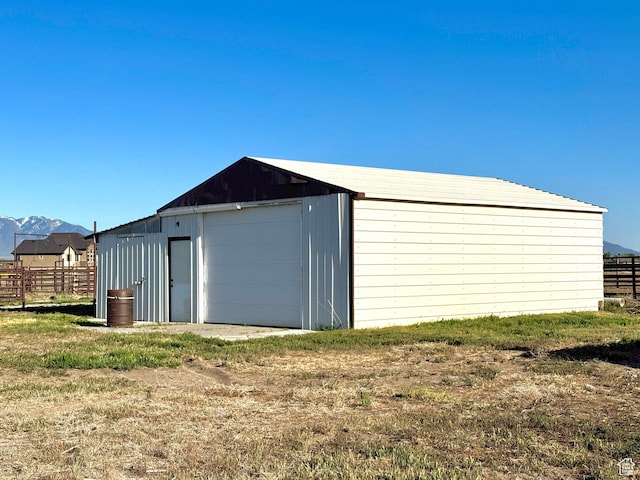 848 N Cooley St W, Grantsville, UT 84029 - detached garage featuring a mountain view and fence
