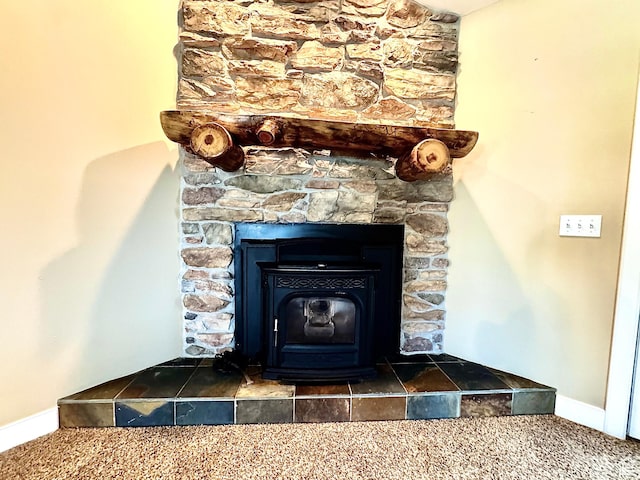 848 N Cooley St W, Grantsville, UT 84029 - details with carpet flooring, baseboards, and a wood stove