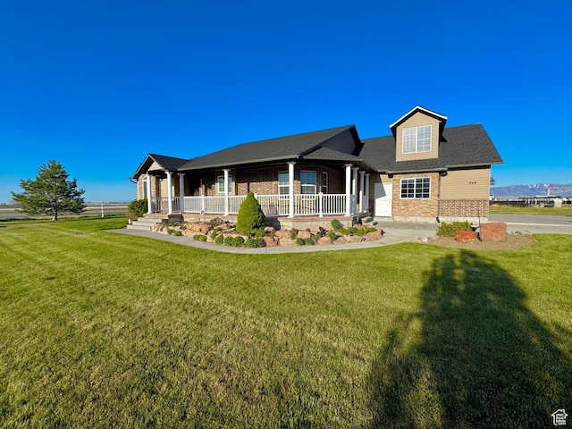 848 N Cooley St W, Grantsville, UT 84029 - view of front of property with brick siding, covered porch, and a front yard