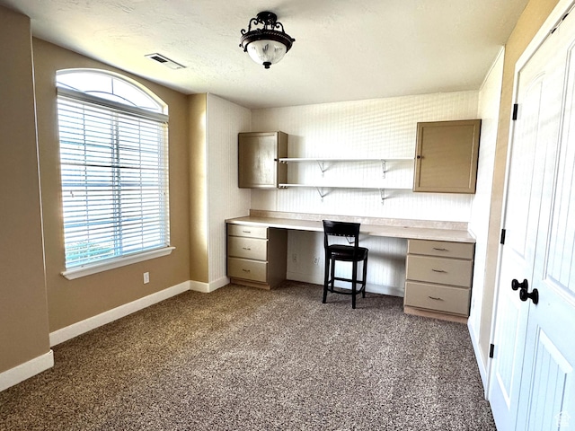 848 N Cooley St W, Grantsville, UT 84029 - unfurnished office with baseboards, visible vents, dark carpet, and built in study area