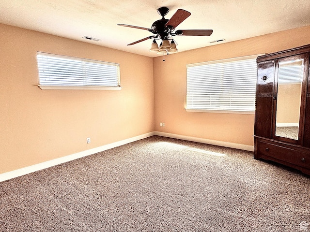 848 N Cooley St W, Grantsville, UT 84029 - unfurnished room with ceiling fan, visible vents, and plenty of natural light