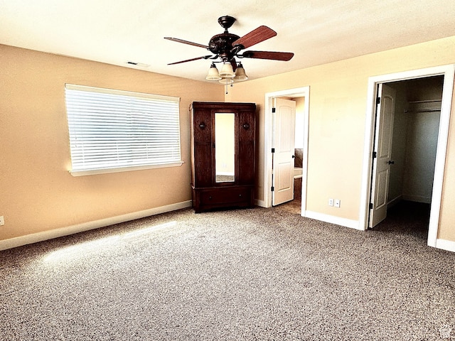 848 N Cooley St W, Grantsville, UT 84029 - unfurnished bedroom with carpet floors, a ceiling fan, baseboards, a spacious closet, and visible vents