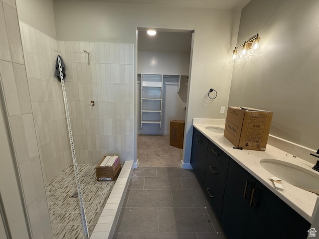 20 N 3830 W Unit 445, West Point, UT 84015 - bathroom featuring a shower stall, double vanity, tile patterned flooring, and a walk in closet