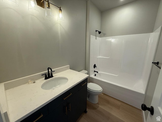 20 N 3830 W Unit 445, West Point, UT 84015 - bathroom with toilet, wood finished floors, shower / washtub combination, and vanity