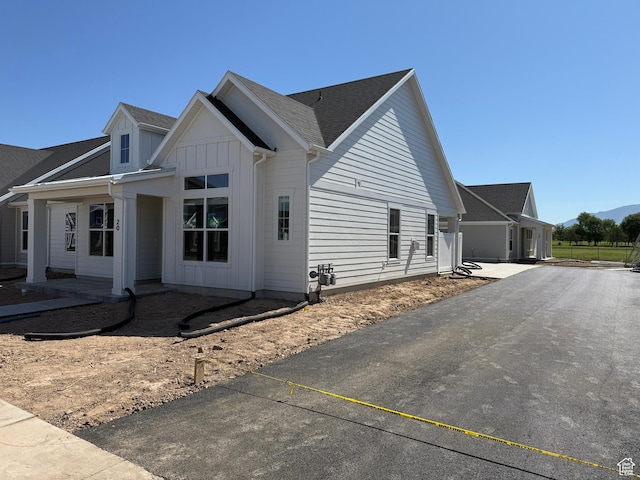 20 N 3830 W Unit 445, West Point, UT 84015 - view of side of property featuring board and batten siding and driveway