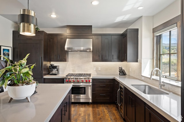 181 N Club Cabins Ct, Heber City, UT 84032 - kitchen featuring exhaust hood, dark brown cabinets, a sink, designer range, and light countertops