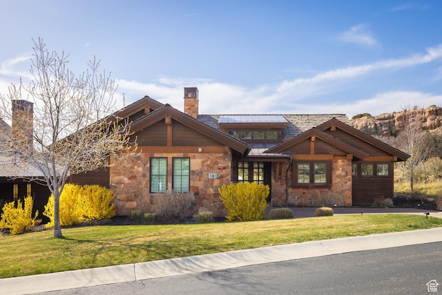 181 N Club Cabins Ct, Heber City, UT 84032 - craftsman-style home featuring a chimney, stone siding, and a front lawn