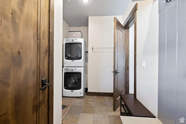 181 N Club Cabins Ct, Heber City, UT 84032 - washroom with laundry area, baseboards, stacked washer / drying machine, and stone finish floor